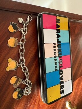 Harajuku Lovers Tin with Multicolor Panel Design and Charm Bracelet